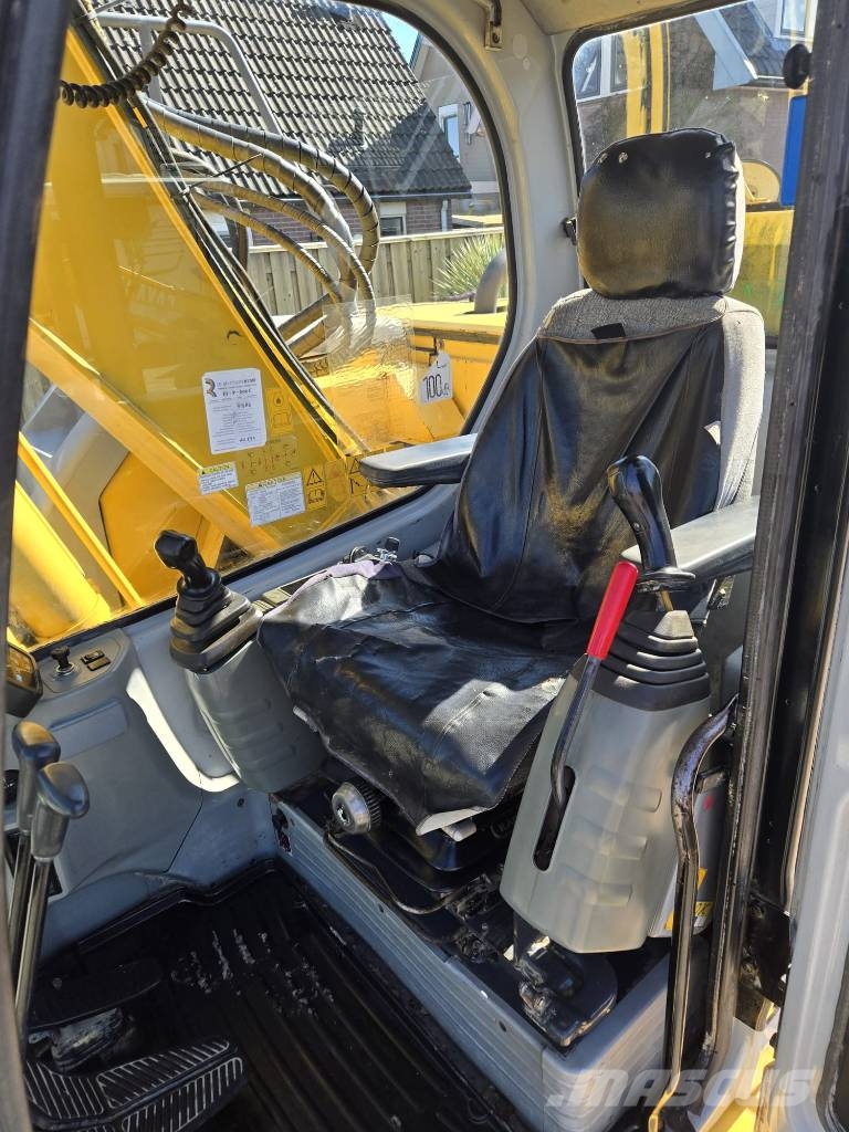 New Holland E 135 SR Bageri guseničari