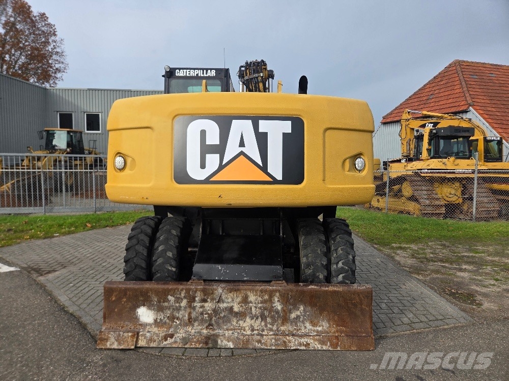 CAT M318D حفارات بعجل