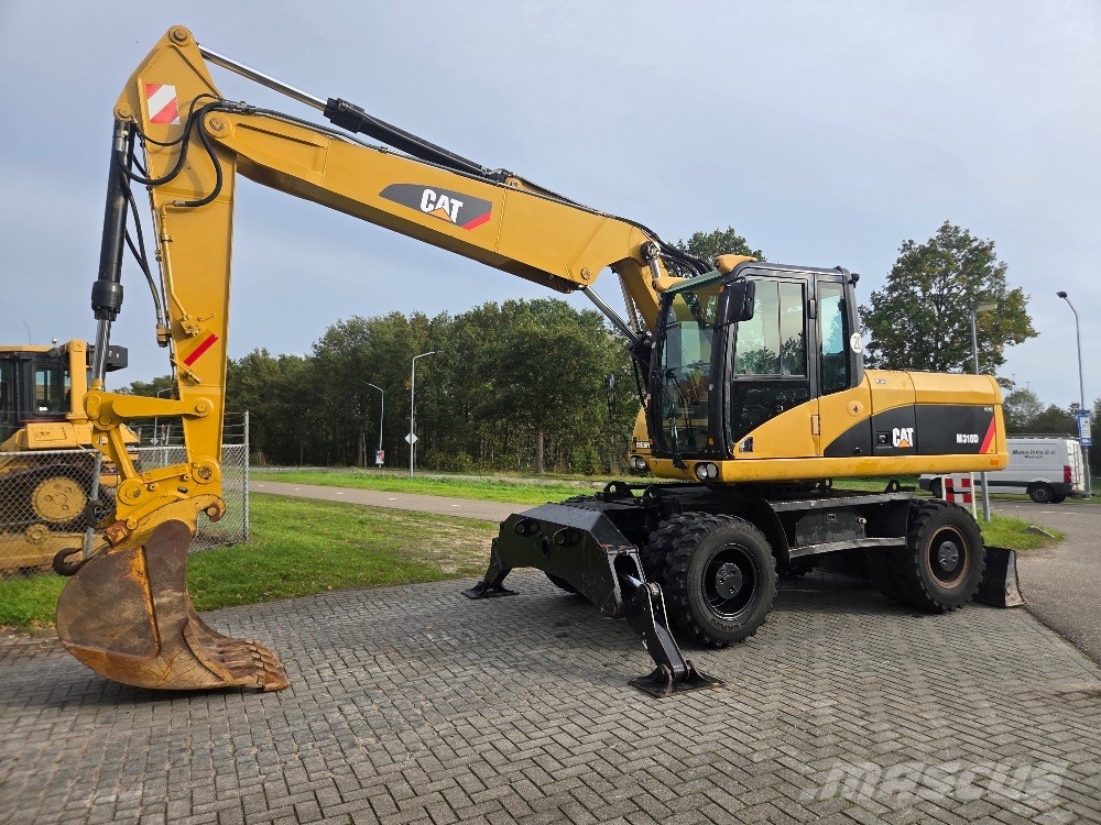 CAT M318D حفارات بعجل