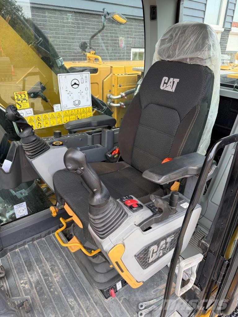 CAT M 318 휠 굴삭기