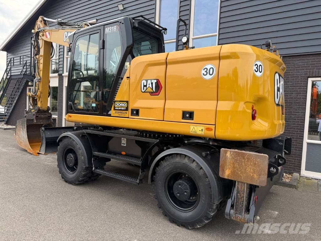 CAT M 318 휠 굴삭기