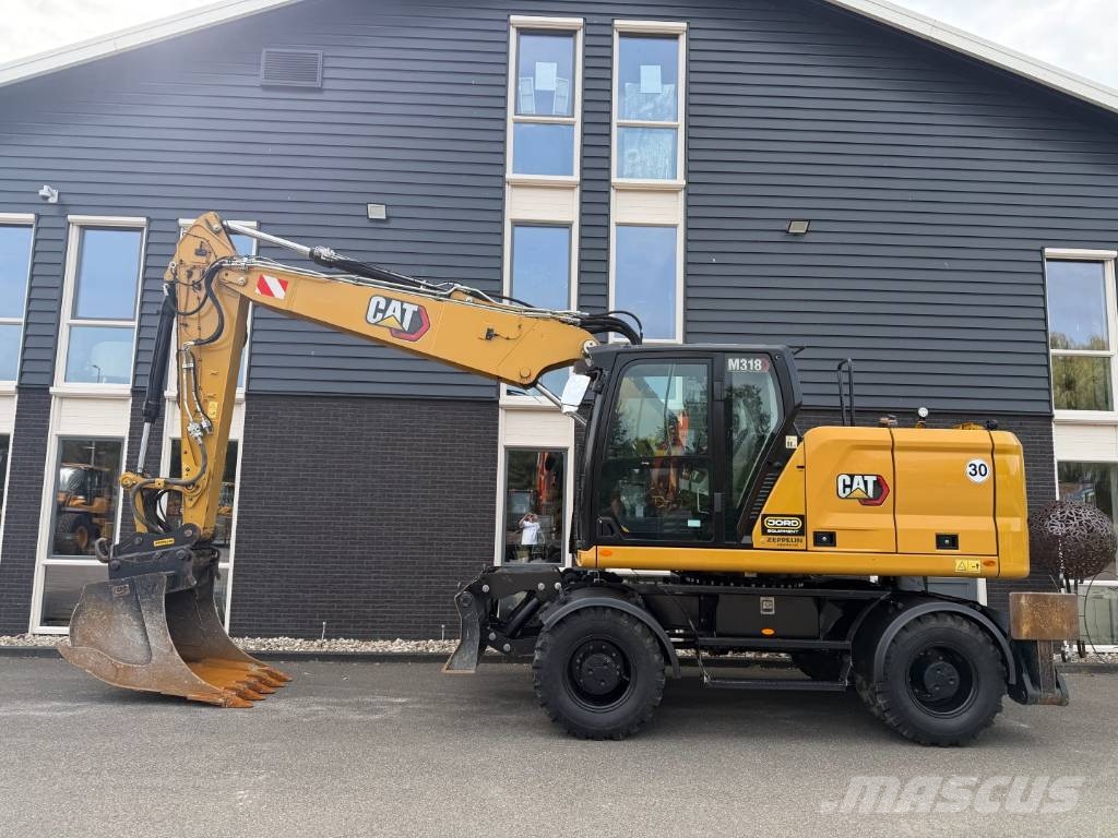 CAT M 318 휠 굴삭기
