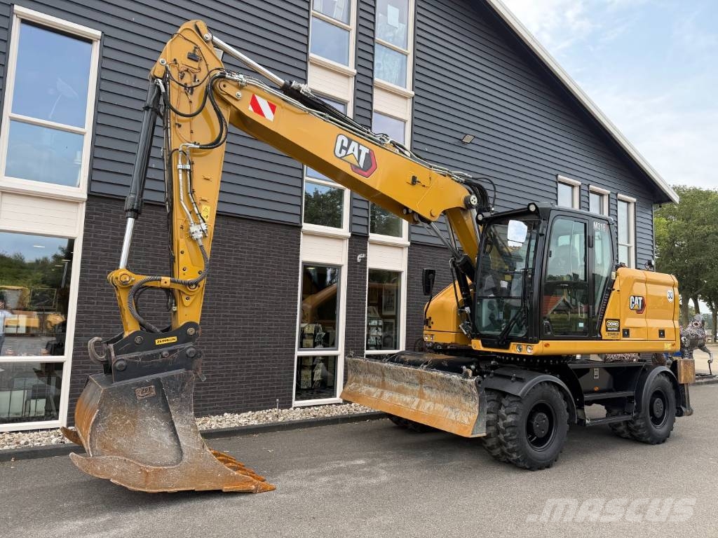 CAT M 318 휠 굴삭기