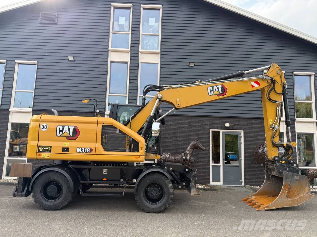 CAT M 318 휠 굴삭기