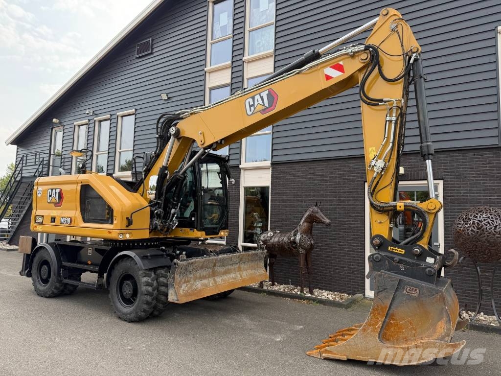 CAT M 318 휠 굴삭기