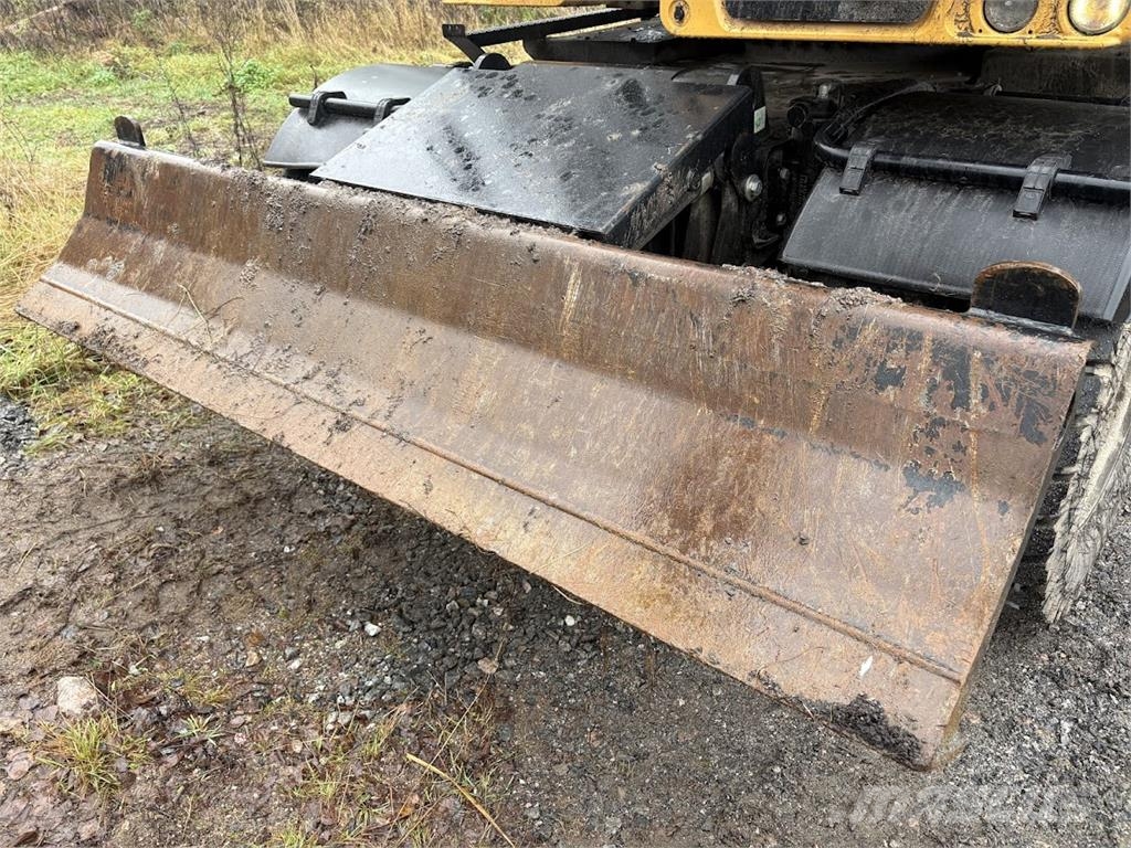 CAT M314 Bagri na kolesih