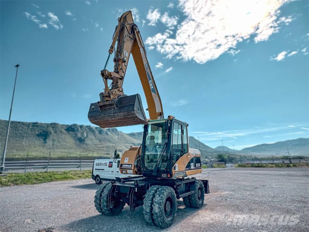 CAT M 313 C Escavadoras de rodas