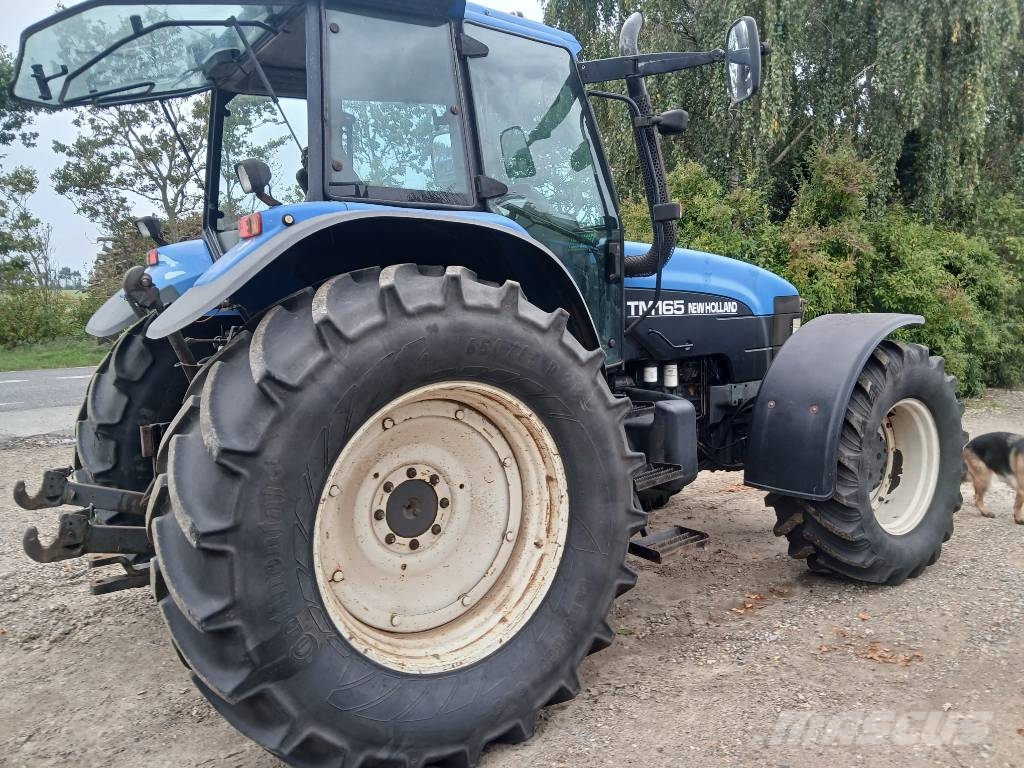 New Holland TM 165 med frontlift og front pto. Traktorji