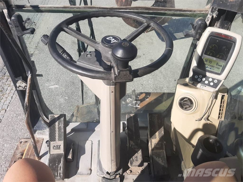 CAT M318C MH Pelle sur pneus