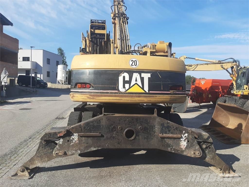CAT M318C MH Pelle sur pneus