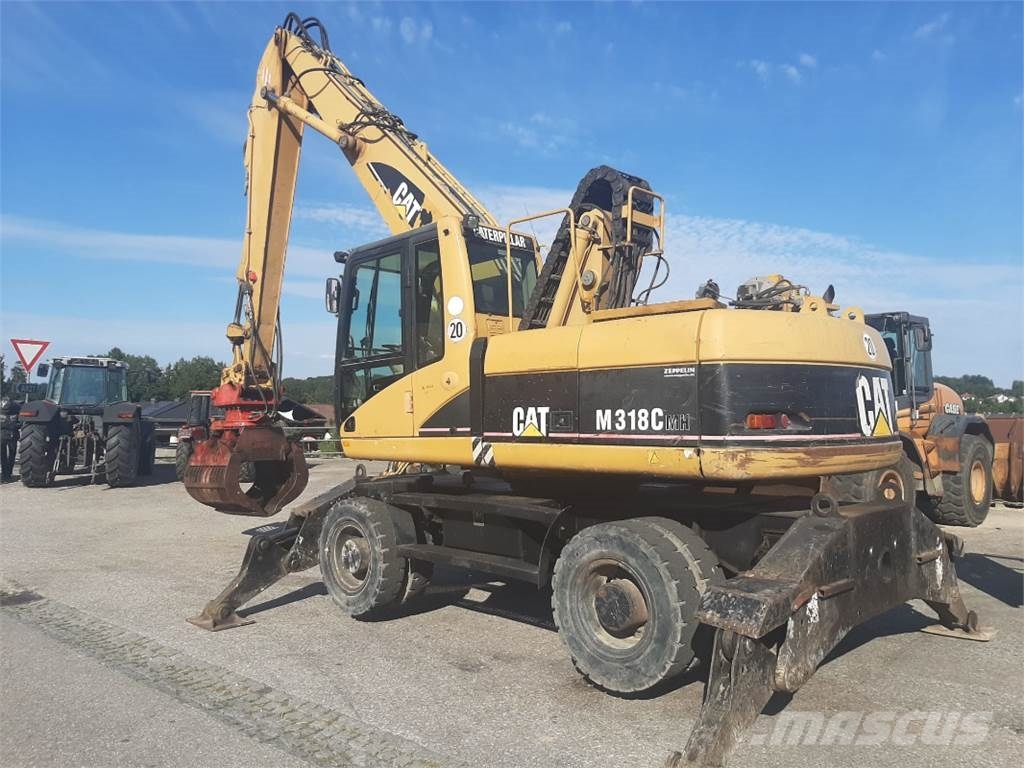 CAT M318C MH Pelle sur pneus