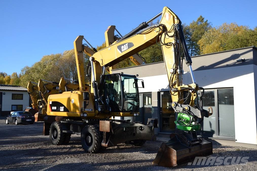 CAT M 318 D  ROTOTILT Колёсные экскаваторы