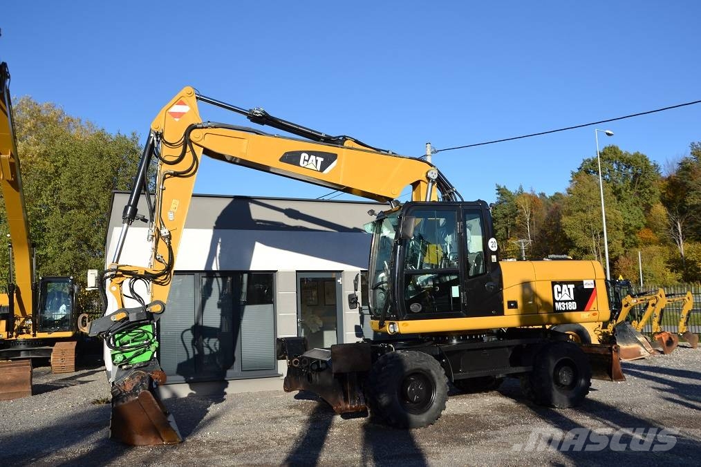 CAT M 318 D  ROTOTILT Колёсные экскаваторы