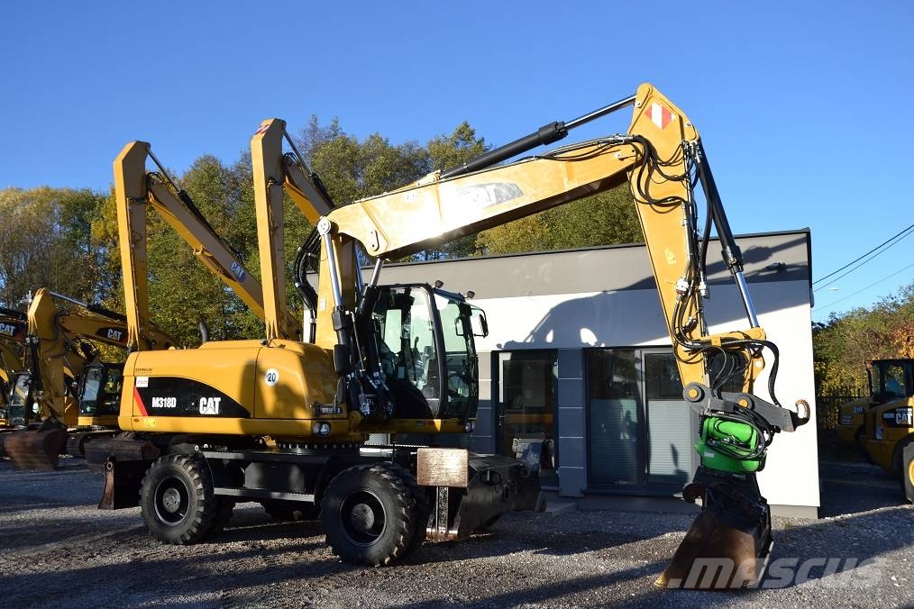 CAT M 318 D  ROTOTILT Колёсные экскаваторы
