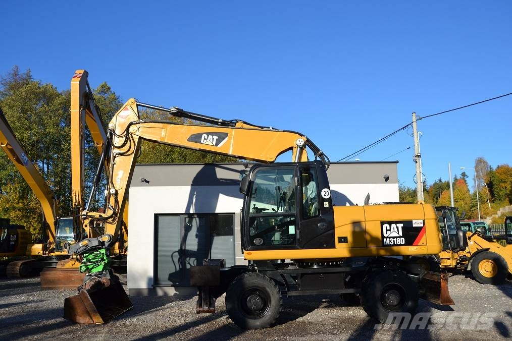 CAT M 318 D  ROTOTILT Колёсные экскаваторы