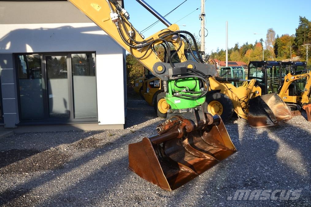 CAT M 318 D  ROTOTILT Колёсные экскаваторы
