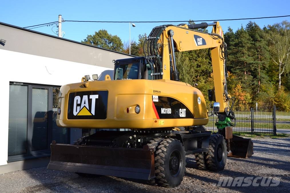 CAT M 318 D  ROTOTILT Колёсные экскаваторы