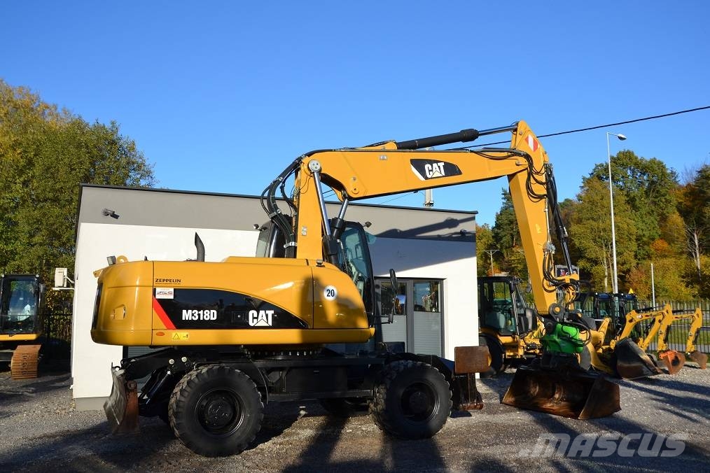 CAT M 318 D  ROTOTILT Колёсные экскаваторы