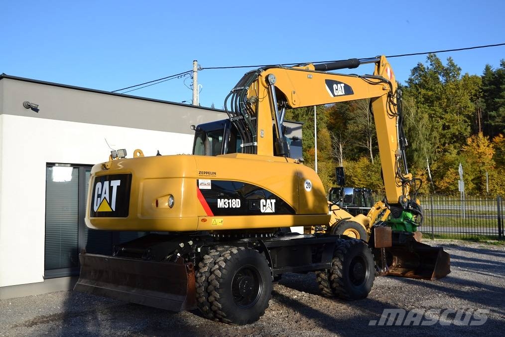 CAT M 318 D  ROTOTILT Колёсные экскаваторы