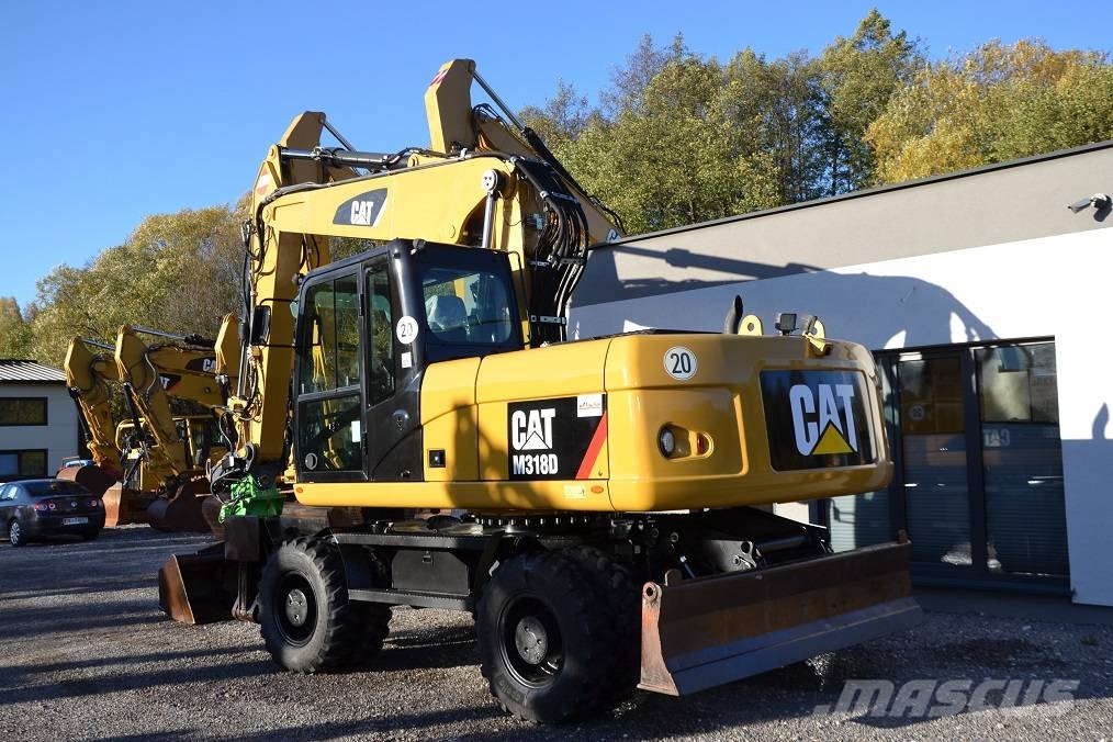 CAT M 318 D  ROTOTILT Колёсные экскаваторы