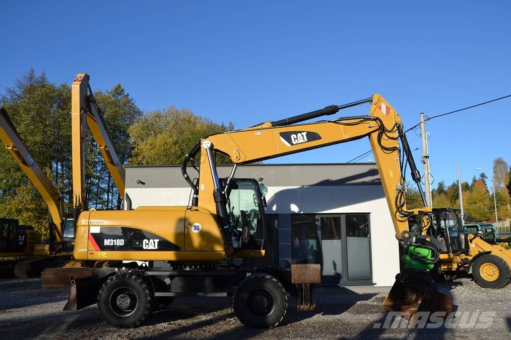 CAT M 318 D  ROTOTILT Колёсные экскаваторы