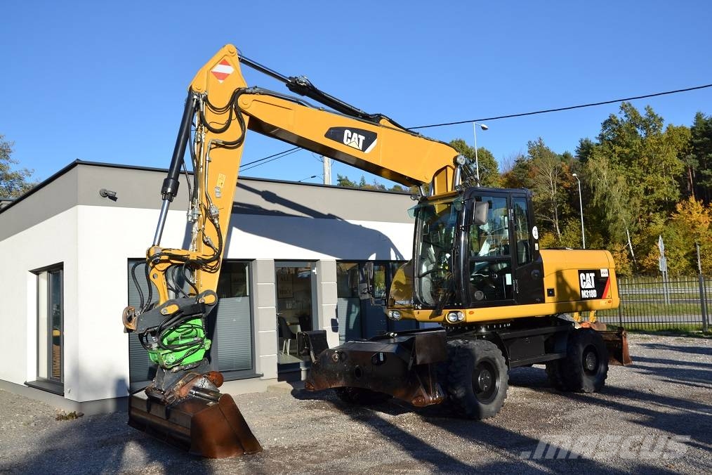 CAT M 318 D  ROTOTILT Колёсные экскаваторы