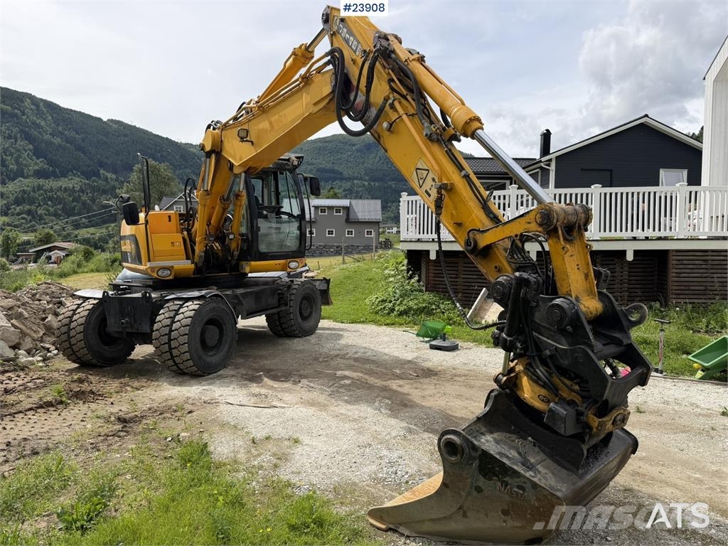 JCB JS145W wheeled machine with a cleaning bucket and  Excavadoras de ruedas