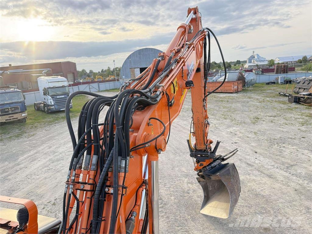 Doosan DX 160 W , ROTO + GRAPPLE Колісні екскаватори