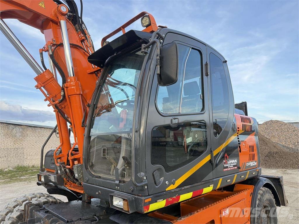 Doosan DX 160 W , ROTO + GRAPPLE Колісні екскаватори