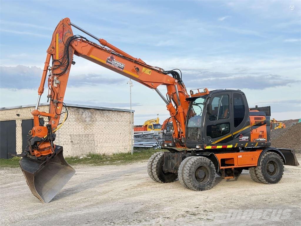 Doosan DX 160 W , ROTO + GRAPPLE Колісні екскаватори
