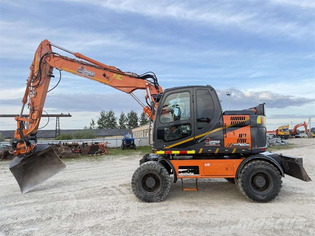 Doosan DX 160 W , ROTO + GRAPPLE Колісні екскаватори