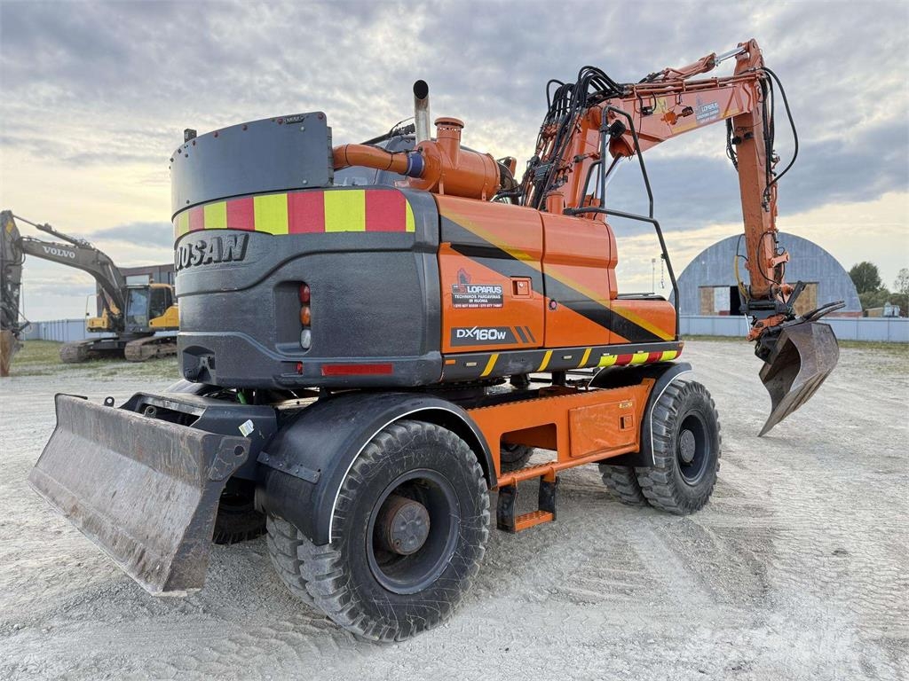 Doosan DX 160 W , ROTO + GRAPPLE Колісні екскаватори