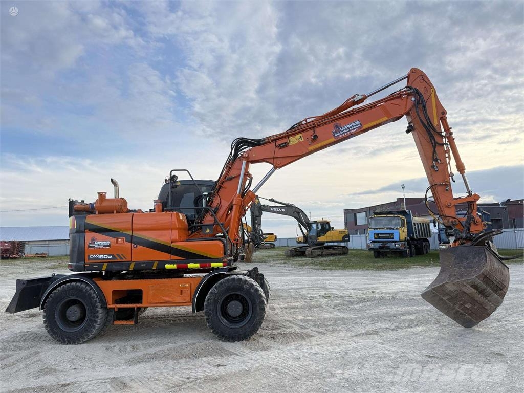 Doosan DX 160 W , ROTO + GRAPPLE Колісні екскаватори