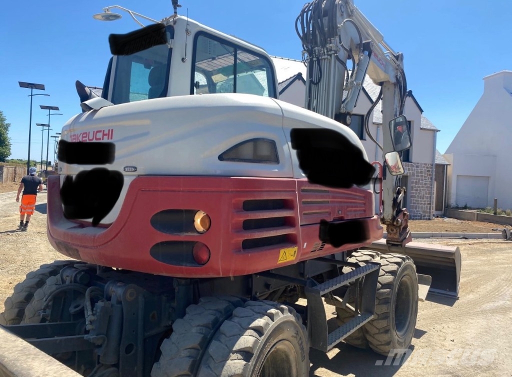 Takeuchi TB 295 W حفارات بعجل