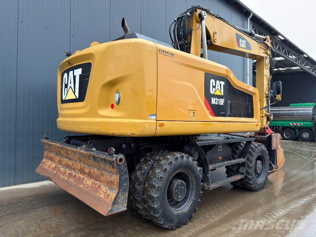 CAT M318F Excavatoare cu roti