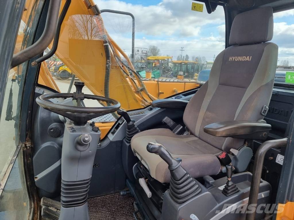 Hyundai Robex 140 W-9 حفارات بعجل