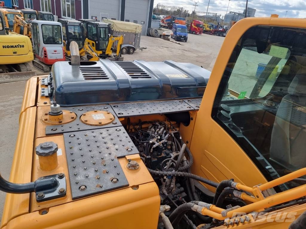 Hyundai Robex 140 W-9 حفارات بعجل