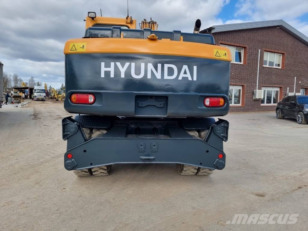 Hyundai Robex 140 W-9 حفارات بعجل