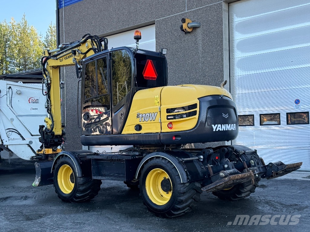 Yanmar B 110 W حفارات بعجل