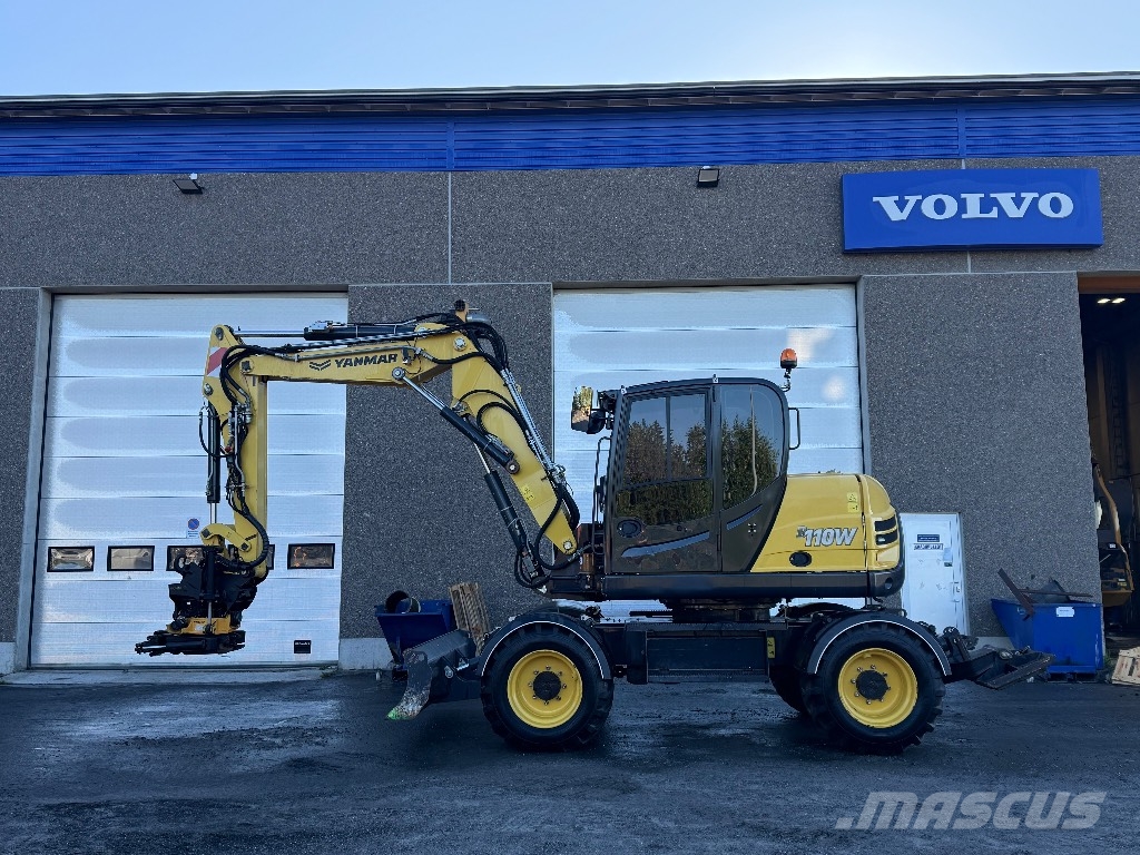 Yanmar B 110 W حفارات بعجل