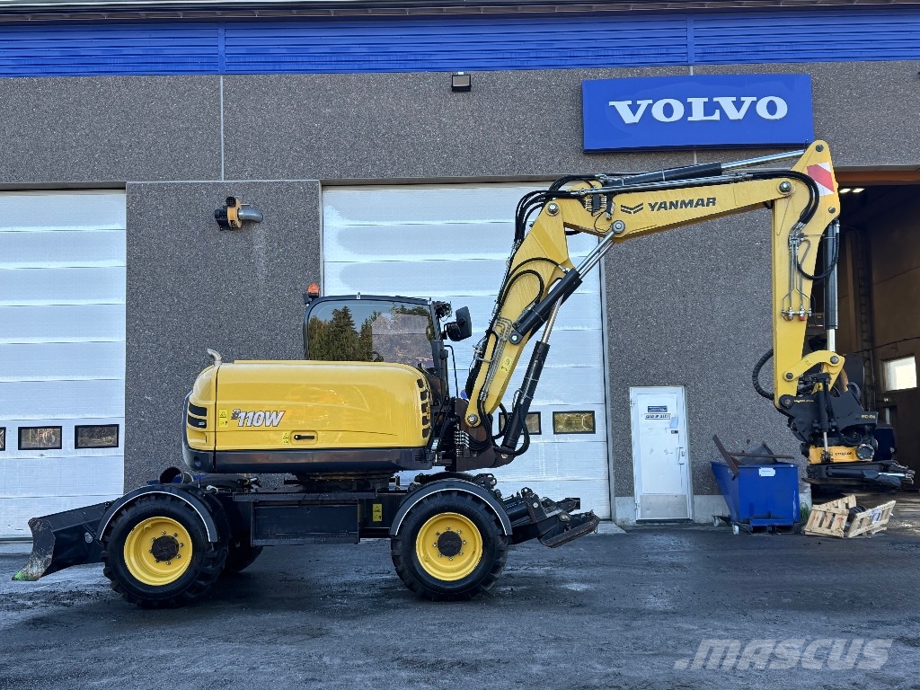 Yanmar B 110 W حفارات بعجل
