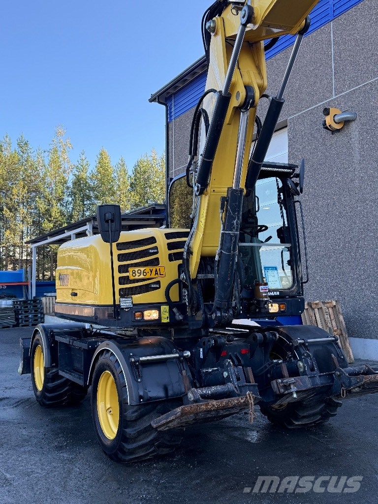 Yanmar B 110 W حفارات بعجل