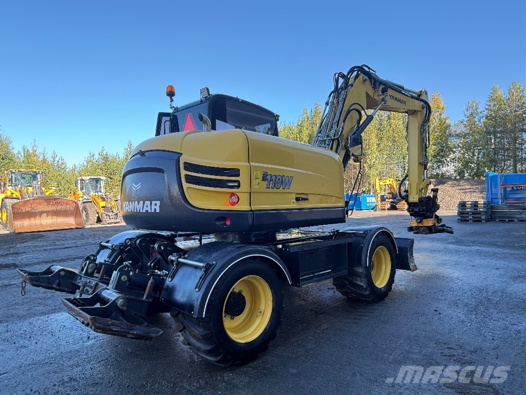 Yanmar B 110 W حفارات بعجل