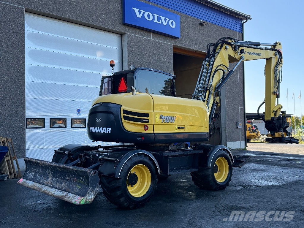 Yanmar B 110 W حفارات بعجل