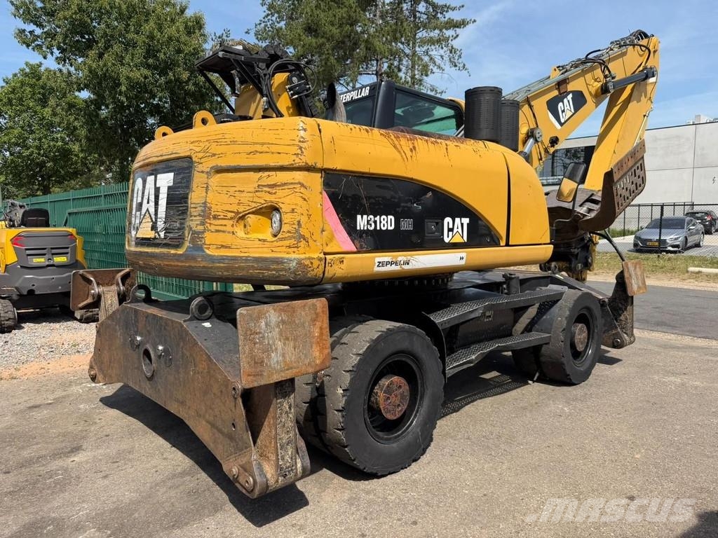CAT M 318 D OVERSLAGKRAAN / MATERIAL HANDLER / UMSCHLA Manejadores de residuos industriales