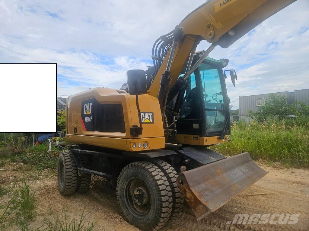 CAT M314F حفارات بعجل
