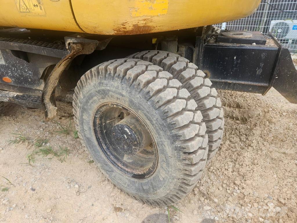 CAT M314F حفارات بعجل