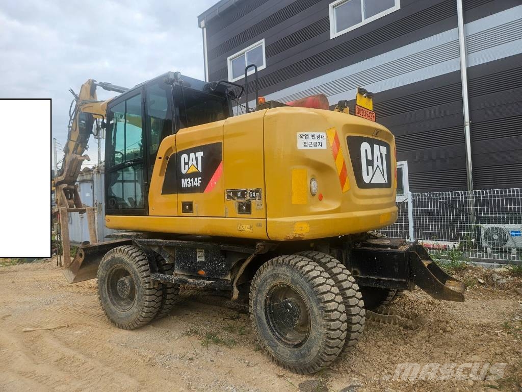 CAT M314F حفارات بعجل
