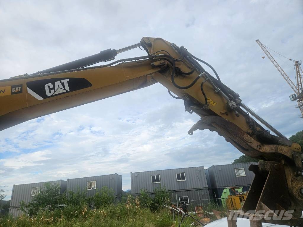 CAT M314F حفارات بعجل