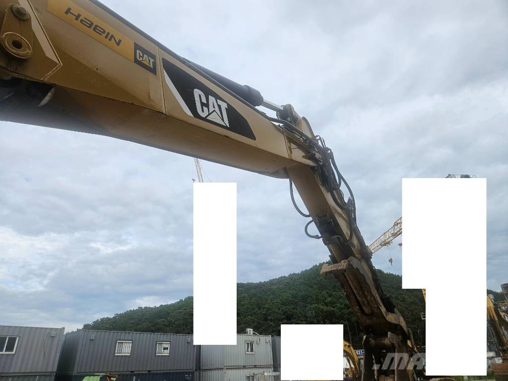 CAT M314F حفارات بعجل